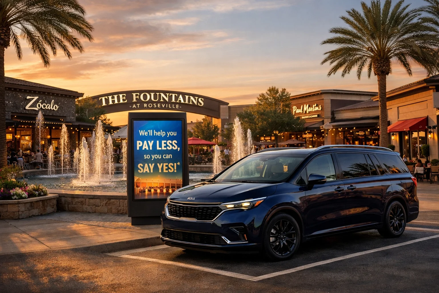 Outdoor dining and shops at The Fountains at Roseville featuring a midnight blue Kia Carnival.